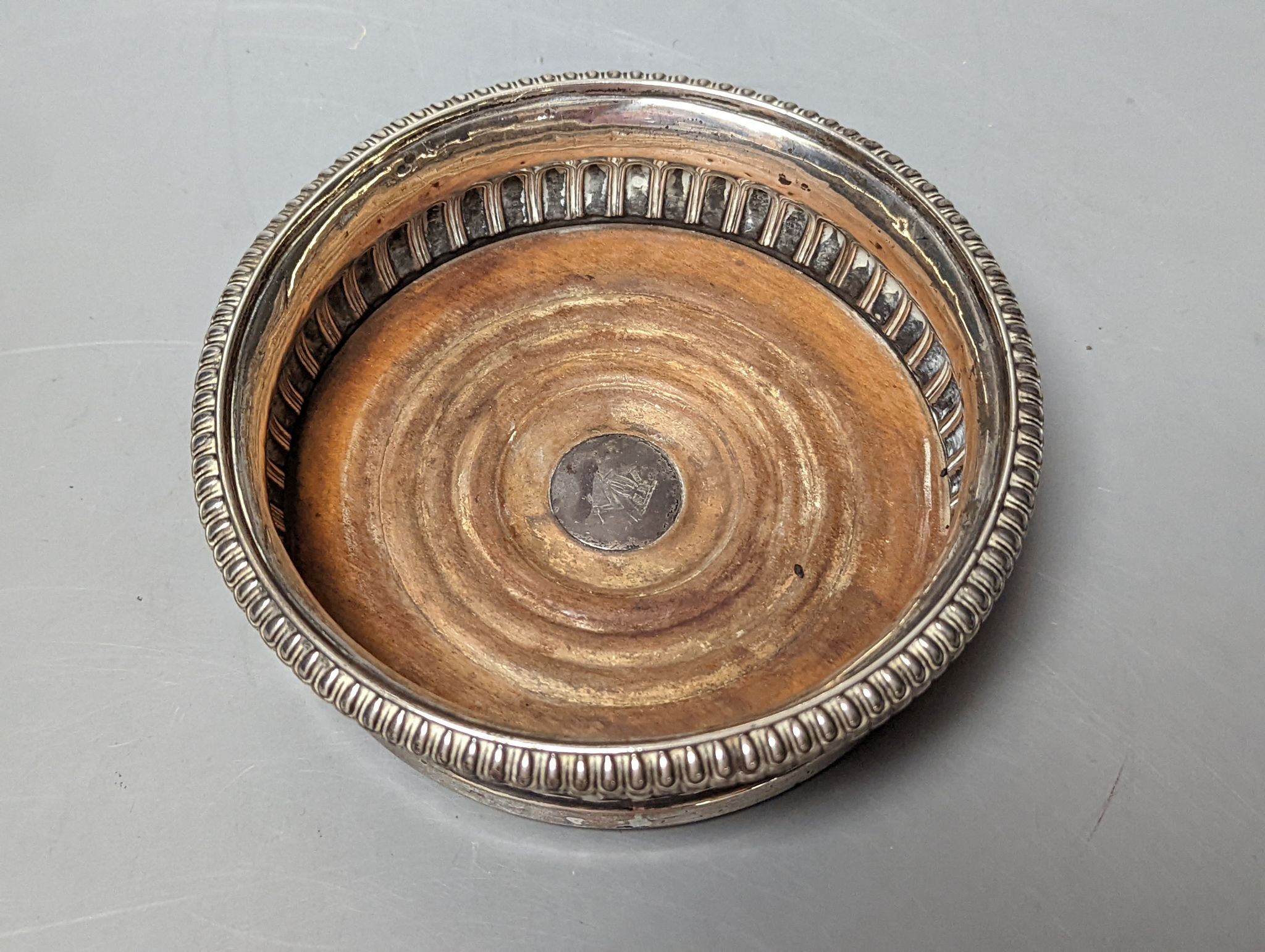 A George III demi fluted silver mounted wine coaster, John Roberts & Co, Sheffield, 1812, diameter 14.7cm.